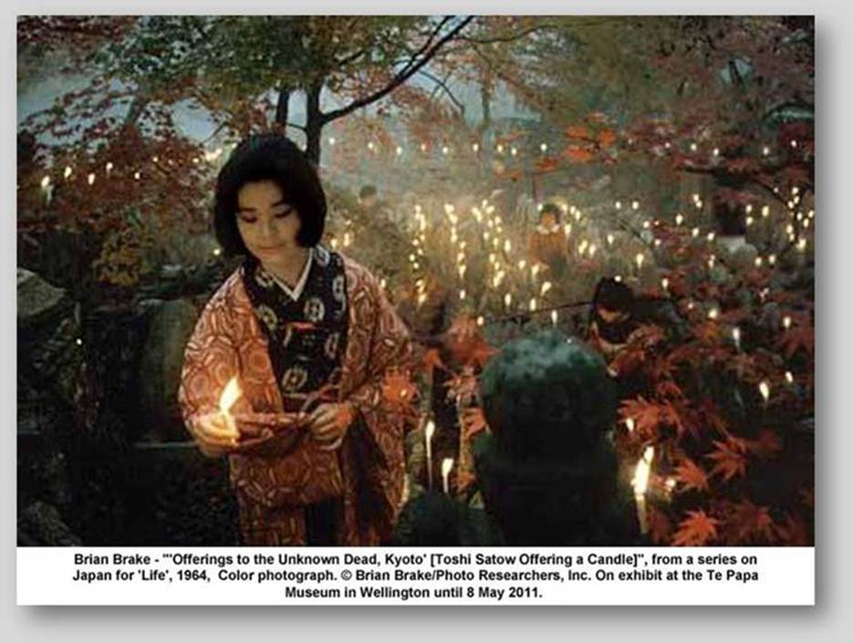 artwork: Brian Brake - "'Offerings to the Unknown Dead, Kyoto' [Toshi Satow Offering a Candle]", from a series on Japan for 'Life', 1964,  Color photograph.  Brian Brake/Photo Researchers, Inc. On exhibit at the Te Papa Museum in Wellington until 8 May 2011.
